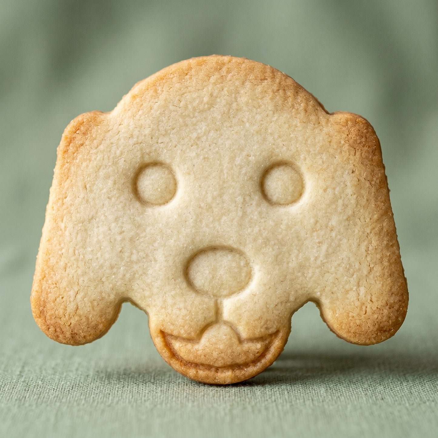 Golden retriever dog face shaped sugar cookie